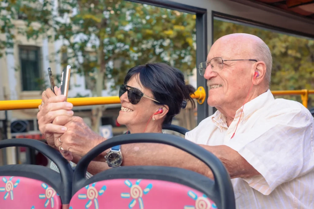 smiling-senior-couple-on charter bus rental